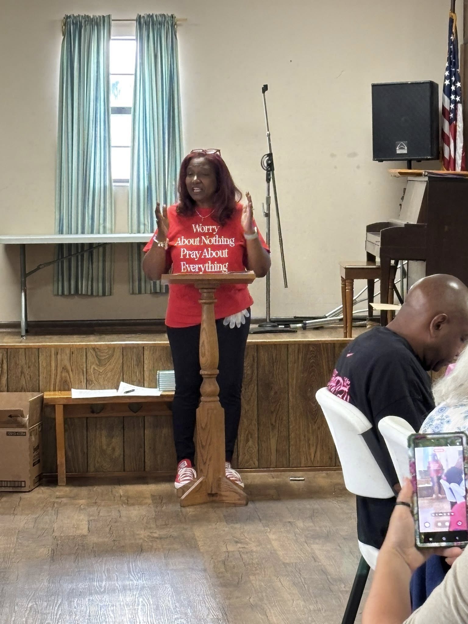 Pastor Juanita speaking at a community event