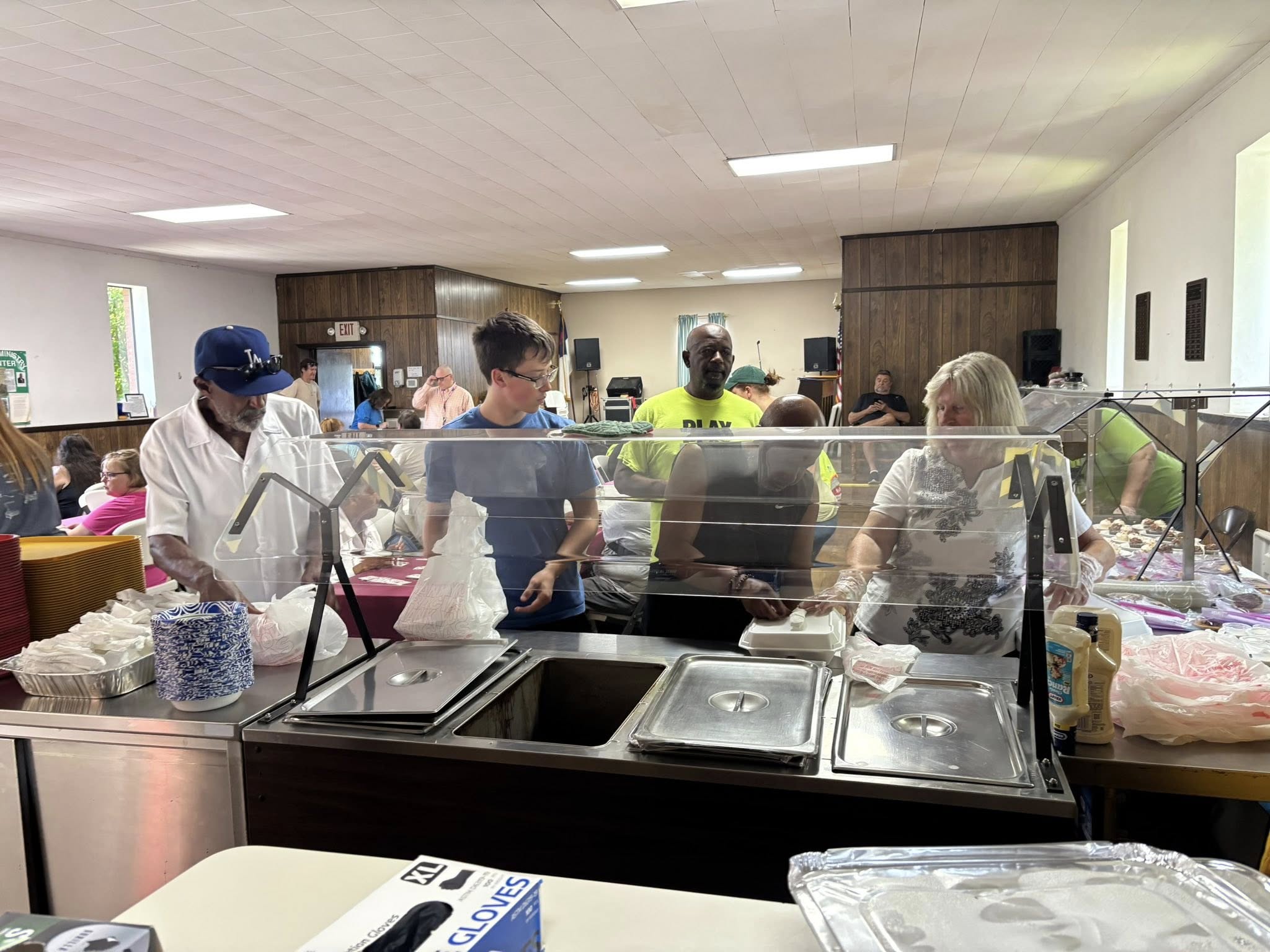 Community members being served a meal